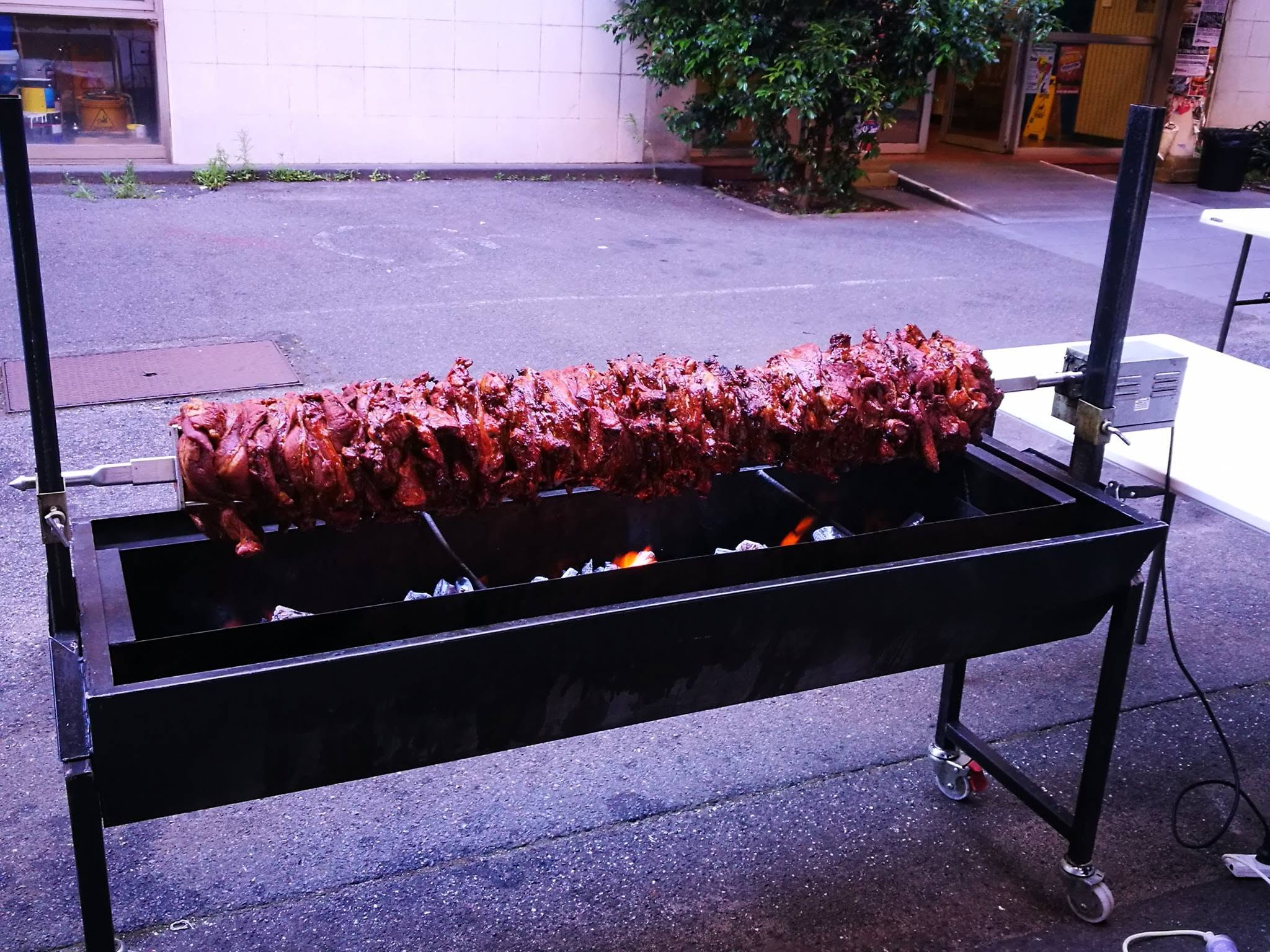 Large spit roast cooking at an outdoor Melbourne venue
